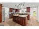 Modern kitchen features wood cabinets, stainless steel appliances, and granite countertops at 103 Chipstone Ct, Peachtree City, GA 30269