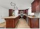 Modern kitchen features wood cabinets, stainless steel appliances, and granite countertops at 103 Chipstone Ct, Peachtree City, GA 30269