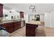Modern kitchen features wood cabinets, stainless steel appliances, and granite countertops at 103 Chipstone Ct, Peachtree City, GA 30269