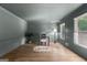 Lovely living room with decorative ceiling, hardwood floors, and many windows at 103 Chipstone Ct, Peachtree City, GA 30269