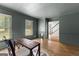 Lovely living room with view of the stairs, hardwood floors, and many windows at 103 Chipstone Ct, Peachtree City, GA 30269