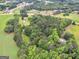 Aerial view of a property surrounded by greenery, showcasing its natural setting at 778 Leguin Mill Rd, Locust Grove, GA 30248