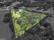 Unique aerial view highlighting the property within a contrasting color overlay at 778 Leguin Mill Rd, Locust Grove, GA 30248