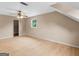 Well-lit bedroom featuring wood floors, a fan, closet and natural light from a window at 778 Leguin Mill Rd, Locust Grove, GA 30248