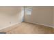 A bright bedroom with hardwood floors, and a door at 778 Leguin Mill Rd, Locust Grove, GA 30248