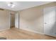 Spacious bedroom with neutral walls, wood floors, and multiple doors at 778 Leguin Mill Rd, Locust Grove, GA 30248