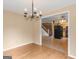 Charming dining room featuring hardwood floors and an elegant chandelier lighting at 778 Leguin Mill Rd, Locust Grove, GA 30248