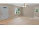 Bright living room featuring hardwood floors, ample natural light, and a classic ceiling fan for a welcoming space at 778 Leguin Mill Rd, Locust Grove, GA 30248