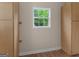 A bright room with wood floors and natural light streaming in through a window at 778 Leguin Mill Rd, Locust Grove, GA 30248