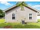 Rear exterior of the home showcasing vinyl siding, windows, and a well-maintained AC unit at 1147 Dunivin Dr, Jonesboro, GA 30238