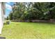 Expansive backyard featuring lush green lawn with mature trees providing privacy at 1147 Dunivin Dr, Jonesboro, GA 30238
