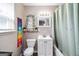 Charming bathroom with updated vanity, toilet, and shower with curtain at 1147 Dunivin Dr, Jonesboro, GA 30238