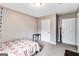 Neutral bedroom with simple bed, side table, and bright natural light at 1147 Dunivin Dr, Jonesboro, GA 30238