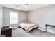 Simple bedroom featuring a twin bed, carpet, and window with blinds at 1147 Dunivin Dr, Jonesboro, GA 30238