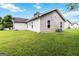 Side and rear exterior view highlighting the well-kept yard and home's clean lines at 1147 Dunivin Dr, Jonesboro, GA 30238