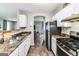 Functional kitchen with stainless steel appliances and a view into the living room at 1147 Dunivin Dr, Jonesboro, GA 30238