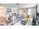 Spacious living room with modern decor, stylish furniture, and ample seating at 1147 Dunivin Dr, Jonesboro, GA 30238