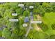 Overhead view shows the residence with outbuildings on a vast, wooded homesite in Loganville, GA at 3100 Meadow Trl, Loganville, GA 30052