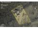Aerial view of lot featuring mature trees, house, and driveway. Lot size is 2.24 acres at 3100 Meadow Trl, Loganville, GA 30052