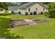 Expansive backyard with garden beds offers a serene setting for gardening and outdoor enjoyment at 3100 Meadow Trl, Loganville, GA 30052