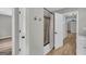 Modern bathroom with new vanity, granite countertops, new hardware, and an open view to the hallway at 3100 Meadow Trl, Loganville, GA 30052
