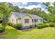 Charming home with red shutters, surrounded by lush landscaping, offers curb appeal and comfort at 3100 Meadow Trl, Loganville, GA 30052