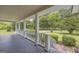 Inviting front porch with views of the landscaped front yard and mature shade trees at 3100 Meadow Trl, Loganville, GA 30052