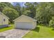 Detached garage providing secure parking and storage space, enhancing the property's value at 3100 Meadow Trl, Loganville, GA 30052