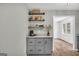 Spacious kitchen featuring granite countertops, modern gray cabinets, and built in coffee bar at 3100 Meadow Trl, Loganville, GA 30052