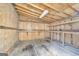 Empty wood shed with shelving and concrete floor, ready for workshop or storage at 3100 Meadow Trl, Loganville, GA 30052