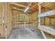 Interior view of the wooden shed featuring a work bench, peg board, and wood frame shelves at 3100 Meadow Trl, Loganville, GA 30052