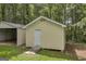 Well-maintained shed with convenient ramp access, perfect for storage and outdoor projects at 3100 Meadow Trl, Loganville, GA 30052