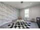 Playroom featuring patterned wallpaper, table, and a checkers rug creates a fun and creative space at 276 Oliver Dr, Locust Grove, GA 30248
