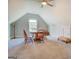 Spacious attic with natural light, a table and chairs, and ample room at 3076 East Lake Rd, Mcdonough, GA 30252