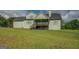 View of a green backyard and deck at 3076 East Lake Rd, Mcdonough, GA 30252