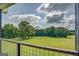 Expansive green space with mature trees, seen from the home's exterior at 3076 East Lake Rd, Mcdonough, GA 30252