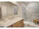 Stylish bathroom with wood vanity, granite countertop, and modern glass shower with a built-in bench at 3076 East Lake Rd, Mcdonough, GA 30252