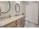 Stylish bathroom featuring double sinks, granite countertops, and modern fixtures at 3076 East Lake Rd, Mcdonough, GA 30252