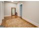 Neutral bedroom with hardwood floors, rug, and large mirror; a simple retreat at 3076 East Lake Rd, Mcdonough, GA 30252