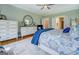 Well-lit bedroom with a decorative mirror and stylish decor at 3076 East Lake Rd, Mcdonough, GA 30252