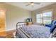 Comfortable bedroom boasts hardwood floors, view of the outdoors and access to an en suite bathroom at 3076 East Lake Rd, Mcdonough, GA 30252