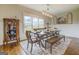 Bright dining room featuring a rustic wooden table with chairs and bench seating at 3076 East Lake Rd, Mcdonough, GA 30252