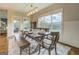 Inviting dining room with large windows, wood table and seating for six at 3076 East Lake Rd, Mcdonough, GA 30252