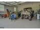 Organized garage with an ATV, tools, and ample workspace at 3076 East Lake Rd, Mcdonough, GA 30252