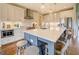 Kitchen boasting white cabinets, stainless steel appliances, an oversized island, and an elegant design at 3076 East Lake Rd, Mcdonough, GA 30252