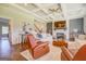 Cozy living room with a brick fireplace, gray accent wall and coffered ceilings at 3076 East Lake Rd, Mcdonough, GA 30252