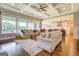 Bright living room showcasing plush seating, hardwood floors, and an open concept layout at 3076 East Lake Rd, Mcdonough, GA 30252