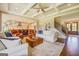 Inviting living room with coffered ceilings, flowing into the kitchen and entry staircase at 3076 East Lake Rd, Mcdonough, GA 30252