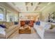 Bright and airy living room with a coffered ceiling that opens to the kitchen at 3076 East Lake Rd, Mcdonough, GA 30252