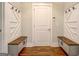 Mudroom with a built-in bench and storage hooks, offering a convenient entryway at 3076 East Lake Rd, Mcdonough, GA 30252